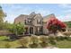 Charming two-story home with inviting front porch and beautifully landscaped front yard at 556 Rolling Meadows Dr, Clayton, NC 27527