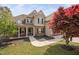 Charming two-story home with inviting front porch and beautifully landscaped front yard at 556 Rolling Meadows Dr, Clayton, NC 27527
