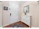 Bright foyer with white door and hardwood floors at 556 Rolling Meadows Dr, Clayton, NC 27527