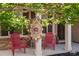Inviting front porch featuring decorative columns and red chairs at 556 Rolling Meadows Dr, Clayton, NC 27527