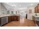 Open kitchen with stainless steel dishwasher overlooking breakfast nook at 556 Rolling Meadows Dr, Clayton, NC 27527