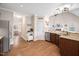 Open kitchen layout with stainless steel appliances and breakfast bar at 556 Rolling Meadows Dr, Clayton, NC 27527