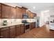 Well-equipped kitchen with stainless steel appliances and dark wood cabinets at 556 Rolling Meadows Dr, Clayton, NC 27527