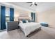 Spacious primary bedroom features tray ceiling, large windows with curtains, and soft carpet flooring at 556 Rolling Meadows Dr, Clayton, NC 27527