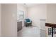 Cozy second floor landing features comfortable chair and natural light from the window at 556 Rolling Meadows Dr, Clayton, NC 27527
