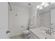 Bathroom featuring a single sink vanity, toilet, and shower/tub combination with a white shower curtain at 5702 Cameo Glass Way, Raleigh, NC 27612