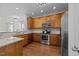 Well-appointed kitchen with granite countertops, stainless steel appliances, and ample cabinet space at 5702 Cameo Glass Way, Raleigh, NC 27612