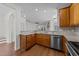 Modern kitchen showcasing stainless steel appliances, granite countertops, and an open layout at 5702 Cameo Glass Way, Raleigh, NC 27612