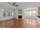 Spacious living room boasts hardwood floors, a fireplace, and plenty of natural light at 5702 Cameo Glass Way, Raleigh, NC 27612