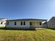 Rear exterior of house shows the backyard and patio at 58 Heatherglenn Cir, Princeton, NC 27569