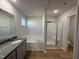 Relaxing bathroom with tub, shower and wood-look flooring at 58 Heatherglenn Cir, Princeton, NC 27569