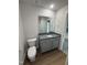 Bathroom featuring vanity, toilet and mirror at 58 Heatherglenn Cir, Princeton, NC 27569