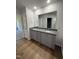 Bathroom featuring double sink vanity with granite countertop at 58 Heatherglenn Cir, Princeton, NC 27569