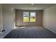 Carpeted bedroom with natural light from double windows at 58 Heatherglenn Cir, Princeton, NC 27569