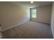 Carpeted bedroom with natural light from window at 58 Heatherglenn Cir, Princeton, NC 27569