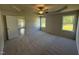 Bright bedroom with large windows, tray ceiling and a ceiling fan at 58 Heatherglenn Cir, Princeton, NC 27569