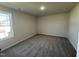Bedroom featuring neutral carpet, light walls and a window providing natural light at 61 Heatherglenn Cir, Princeton, NC 27569