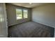 Bedroom with neutral carpet, light walls and two windows providing an abundance of natural light at 61 Heatherglenn Cir, Princeton, NC 27569