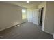 Bedroom featuring plush carpeting, a window, and a closet with bright white doors at 61 Heatherglenn Cir, Princeton, NC 27569