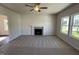 Inviting living room with carpet, a fireplace, and abundant natural light at 61 Heatherglenn Cir, Princeton, NC 27569