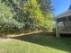 Home with mature trees bordering the property, providing privacy and natural beauty at 66 Saddle Ln, Lillington, NC 27546