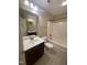 Bathroom with a vanity and a shower-tub combo at 66 Saddle Ln, Lillington, NC 27546