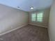 Bedroom with large window at 66 Saddle Ln, Lillington, NC 27546