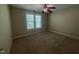 A spacious bedroom with a ceiling fan and natural light, carpeted at 66 Saddle Ln, Lillington, NC 27546