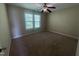 Bright bedroom with a ceiling fan and natural light from a window, carpeted at 66 Saddle Ln, Lillington, NC 27546