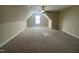 Bright carpeted bedroom illuminated by a window creates a serene and inviting atmosphere at 66 Saddle Ln, Lillington, NC 27546
