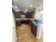 Modern kitchen featuring stainless steel appliances, granite countertops, and updated cabinets at 66 Saddle Ln, Lillington, NC 27546