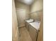 A convenient laundry room features tile flooring, washer, dryer, and a storage shelf at 66 Saddle Ln, Lillington, NC 27546