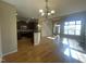 Open living and dining area with hardwood floors, stainless appliances and ample natural light at 66 Saddle Ln, Lillington, NC 27546