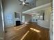 Bright and open living room featuring hardwood floors, fireplace, and cathedral ceiling at 66 Saddle Ln, Lillington, NC 27546