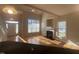 Living room featuring fireplace, hardwood floors, and ample natural light at 66 Saddle Ln, Lillington, NC 27546