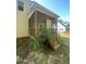 Cozy screened porch with wooden railing and steps, perfect for relaxation at 66 Saddle Ln, Lillington, NC 27546