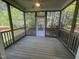 Enclosed screened porch with views of the backyard at 66 Saddle Ln, Lillington, NC 27546