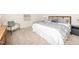 Bedroom with neutral walls, carpet, and woven headboard with decorative grey bedding at 67 Fern Ridge Dr, Cameron, NC 28326