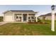 Charming single-story home featuring a covered front porch with stylish seating at 67 Fern Ridge Dr, Cameron, NC 28326