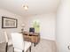 Office with a modern desk, neutral walls, carpet, and window with bright, natural light at 67 Fern Ridge Dr, Cameron, NC 28326