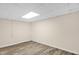 Finished basement featuring hard wood floors and neutral walls at 6702 Huntsboro Rd, Oxford, NC 27565