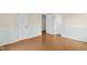 Bedroom with hardwood floors, fresh wall paint, and new trim at 6702 Huntsboro Rd, Oxford, NC 27565
