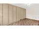 Bedroom with wall-to-wall closets, neutral color scheme, and a ceiling fan at 6702 Huntsboro Rd, Oxford, NC 27565