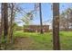 Home's brick exterior with trees and grass in the background at 6702 Huntsboro Rd, Oxford, NC 27565