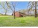 Exterior view of the brick home with a large green yard at 6702 Huntsboro Rd, Oxford, NC 27565