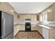 Kitchen features light wood cabinets, tile flooring, and stainless steel refrigerator at 6702 Huntsboro Rd, Oxford, NC 27565