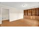 Bright living room with hardwood floors, built-in shelving, and ample natural light at 6702 Huntsboro Rd, Oxford, NC 27565