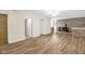 Spacious living room with hardwood floors, a fireplace, and two open doorways at 6702 Huntsboro Rd, Oxford, NC 27565