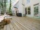 An expansive back deck with a white house exterior, barbecue, and outdoor seating, perfect for entertaining at 6909 Clear Sailing Ln, Raleigh, NC 27615