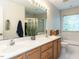 Bright bathroom with a double vanity, large mirror, and a soaking tub at 6909 Clear Sailing Ln, Raleigh, NC 27615